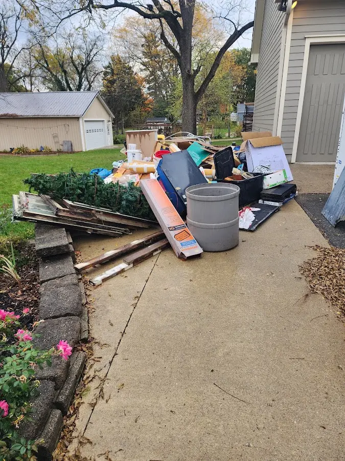 Dumpster being loaded with debris for Residential Dumpster Rental in Bailey's Crossroads